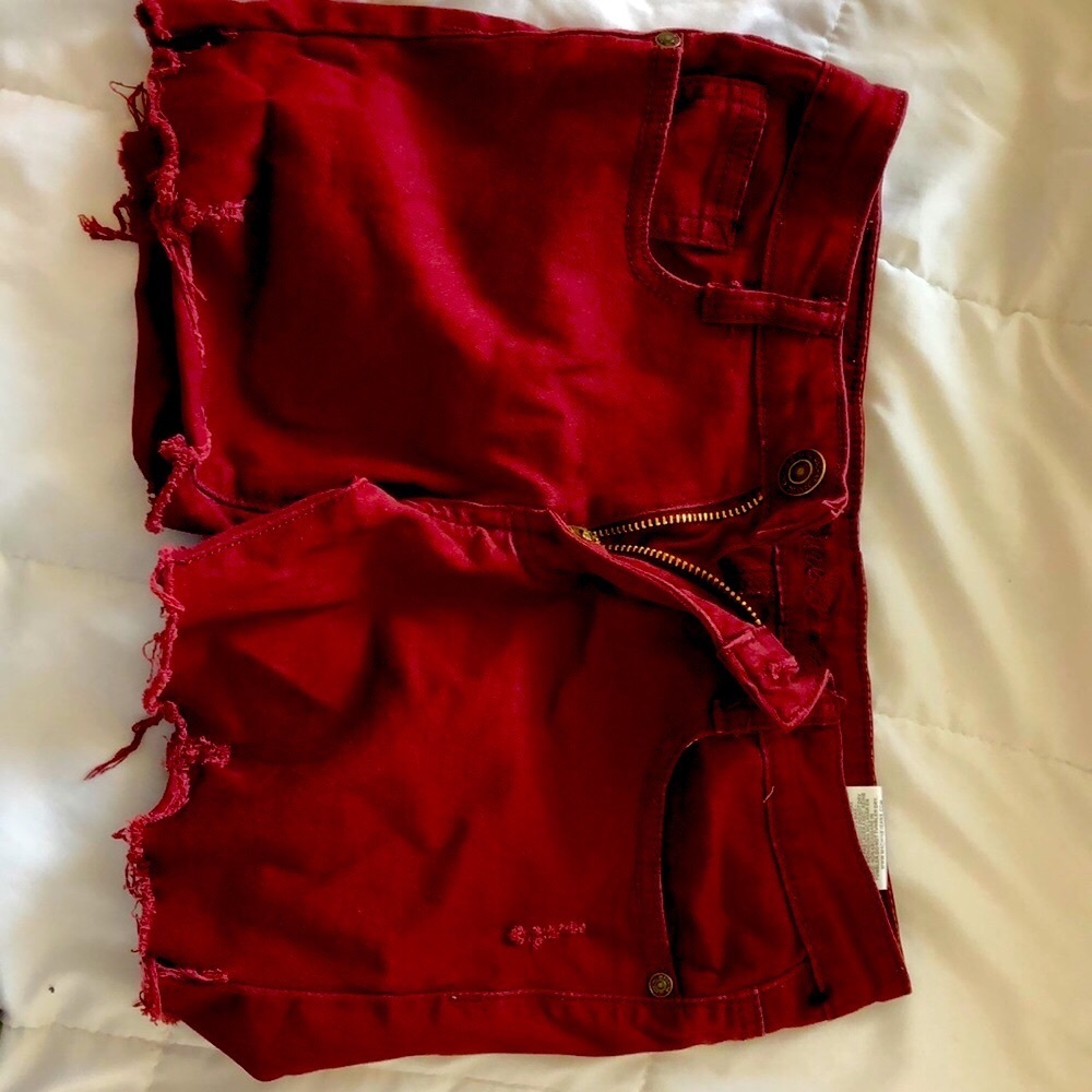 Dark red shorts, size small,machine brand